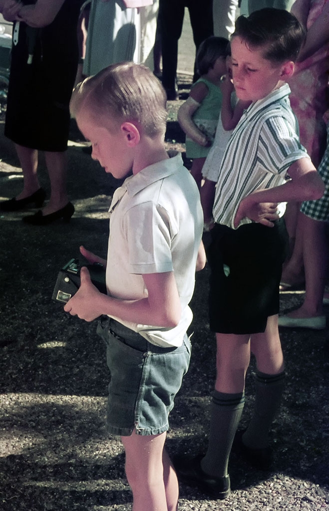 Boy with box camera